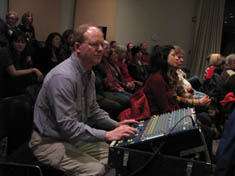 Photo of volunteer at sound board