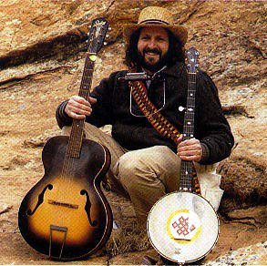 Photo of Ralph Litwin with guitar and banjo